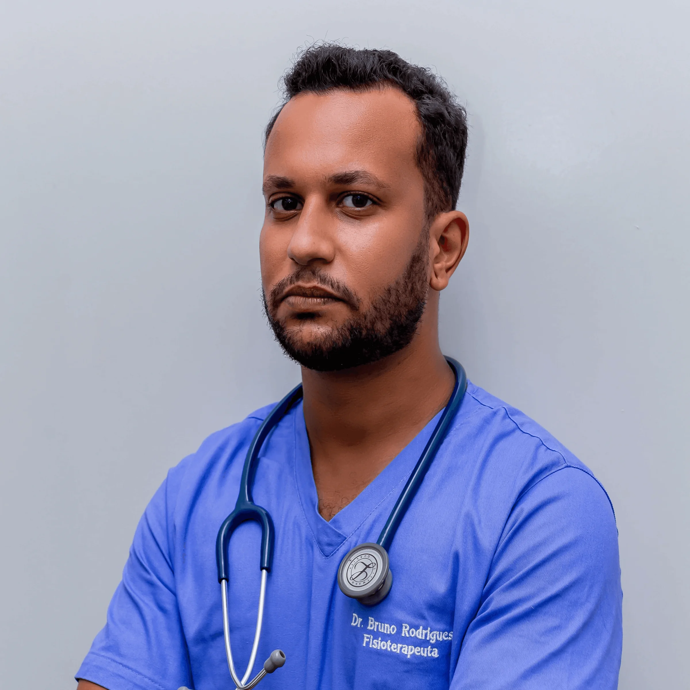man in blue crew neck t-shirt wearing blue stethoscope